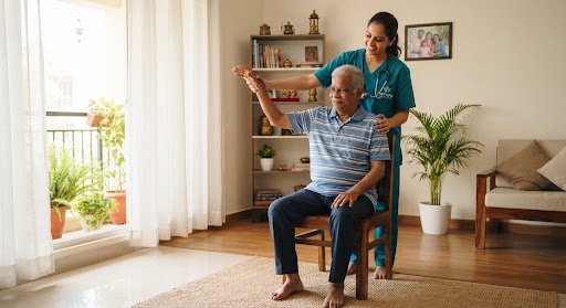 Physiotherapist treating an elderly patient at home